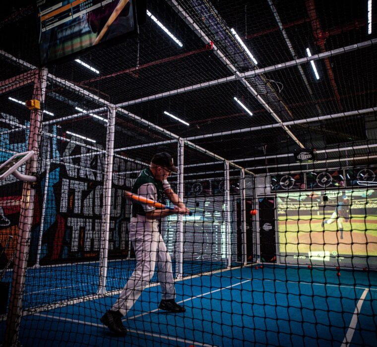 A batter on a Baseball Simulator